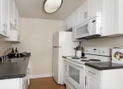 Thumbnail 39 of 86 - brewster furnished kitchen at Avenue Two Apartments, Redwood City  ,California, 94063