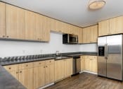 Thumbnail 12 of 86 - kitchen with stainless steel appliances at Avenue Two Apartments, Redwood City  , California