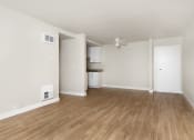 Thumbnail 67 of 86 - seaport unfurnished living room with wood plank style flooring at Avenue Two Apartments, Redwood City
