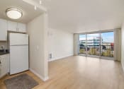 Thumbnail 59 of 86 - ralston floor plan unfurnished kitchen and living room area at Avenue Two Apartments, Redwood City  , CA