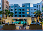 Thumbnail 14 of 29 - A modern building with a pool in the courtyard. at Baker Block, Costa Mesa, CA