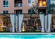 Thumbnail 8 of 29 - A pool area with a building at Baker Block, Costa Mesa, CA, 92626