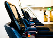 Thumbnail 19 of 29 - A row of treadmills are lined up in a gym. at Baker Block, Costa Mesa, CA