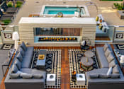 Thumbnail 3 of 29 - A modern outdoor living space with a pool and a fireplace. at Baker Block, California