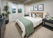 Thumbnail 20 of 24 - Spacious Bedroom With Plush Carpeting, High Ceiling, And Two Windows at NoMa Apartments, California, 94596