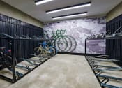 Thumbnail 12 of 24 - a room filled with bikes and a mural of a city on the wall at NoMa Apartments, Walnut Creek, CA