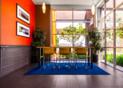 Thumbnail 17 of 50 - a dining room with a table and chairs in front of a window