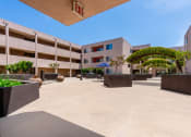 Thumbnail 41 of 50 - a courtyard in front of a building of a hotel