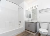Thumbnail 50 of 50 - a bathroom with a toilet and a tub