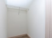 Thumbnail 44 of 50 - an empty room with a white wall and a wire rack on the wall