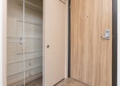 Thumbnail 45 of 50 - a door to a closet with empty shelves on the door