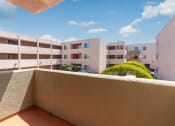Thumbnail 47 of 50 - a balcony with a view of an apartment building