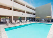 Thumbnail 28 of 50 - Pool with lounge seating