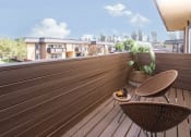 Thumbnail 34 of 77 - a deck with two chairs and a potted plant on it