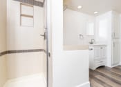 Thumbnail 37 of 77 - a bathroom with a shower and a sink
