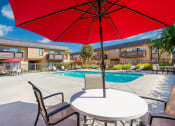 Thumbnail 18 of 77 - resident pool with patio seating