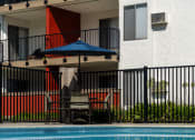 Thumbnail 14 of 36 - a building with a swimming pool in front of it