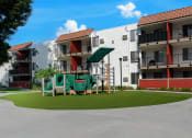 Thumbnail 15 of 36 - a playground in the middle of an apartment courtyard