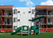 Thumbnail 17 of 36 - a playground in front of an apartment building
