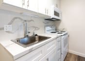 Thumbnail 31 of 36 - Kitchen stove and sink
