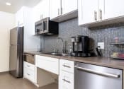 Thumbnail 26 of 36 - Clubroom with stainless steel appliances