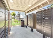 Thumbnail 65 of 91 - A row of mailboxes are lined up on a sidewalk.