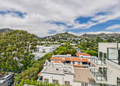 Thumbnail 33 of 117 - A view of a residential area with houses and trees at Skyview Sunset Apartments, Los Angeles, CA