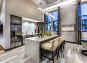 Thumbnail 16 of 62 - resident kitchen with hd tvs at Capriana at Chino Hills, Chino Hills, CA