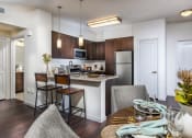 Thumbnail 25 of 62 - furnished kitchen with stainless steel appliances at Capriana at Chino Hills, California