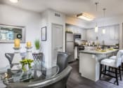 Thumbnail 30 of 62 - furnished kitchen and dining area at Capriana at Chino Hills, California