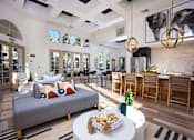 Thumbnail 42 of 52 - A modern living room with a grey sofa and a white coffee table at Capriana at Chino Hills, California, 91709