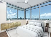 Thumbnail 45 of 127 - A bedroom with a large bed and a view of the city.