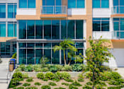 Thumbnail 70 of 127 - A modern building with a glass facade and a sign that reads "Cristallo Cafe".