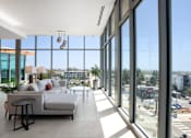 Thumbnail 11 of 127 - A modern living room with a view of the city.
