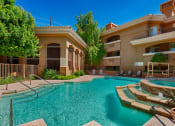 Thumbnail 4 of 18 - Apartments for Rent Old Town Scottsdale AZ - Cibola - Pool Area with Jacuzzi, Lounge Chairs, and Planters