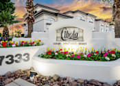 Thumbnail 2 of 48 - The image shows a sign for Cibola Luxury Apartment Homes with a number 7333 and a garden in front.