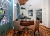 Thumbnail 13 of 48 - A room with a desk and two chairs.