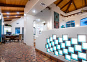 Thumbnail 14 of 48 - A wall of illuminated rectangles is on display in a room with a wooden ceiling.