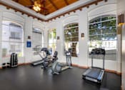 Thumbnail 15 of 48 - A gym with treadmills, exercise bikes and weights.