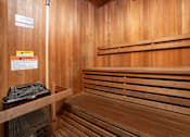 Thumbnail 17 of 48 - A wooden sauna with a sign on the wall.