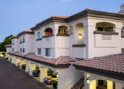 Thumbnail 43 of 48 - A row of houses with cars parked in front.