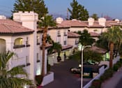 Thumbnail 45 of 48 - A street view of a residential area with houses and palm trees.