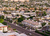 Thumbnail 47 of 48 - A cityscape with buildings and roads.
