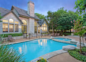 Thumbnail 1 of 40 - North Austin, TX, Apartments with In-Unit Washer and Dryer - Museo Channings Mark - Swimming Pool With Sundeck, Lounge Chairs, Poolside Picnic Area, And Lush Trees.
