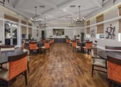 Thumbnail 18 of 25 - a large room with hardwood floors and white walls at 55+ Remington at Ladera Ranch, California, 92694