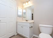 Thumbnail 51 of 80 - a bathroom with a toilet sink and mirror