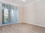 Thumbnail 45 of 80 - an empty bedroom with a large window and blinds