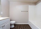 Thumbnail 49 of 80 - a bathroom with a toilet sink and bathtub