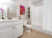 Thumbnail 57 of 80 - a bathroom with a toilet sink and bathtub