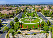 Thumbnail 71 of 80 - A view of a park in a residential area with a sign that says College Park.